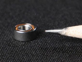 More compact, lighter and cleaner miniature bearing